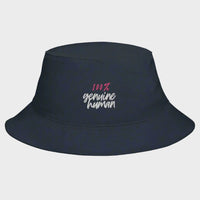 A black bucket hat with the text '100% genuine human' printed on the front.