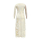 Long, light-colored dress with floral patterns on a white background