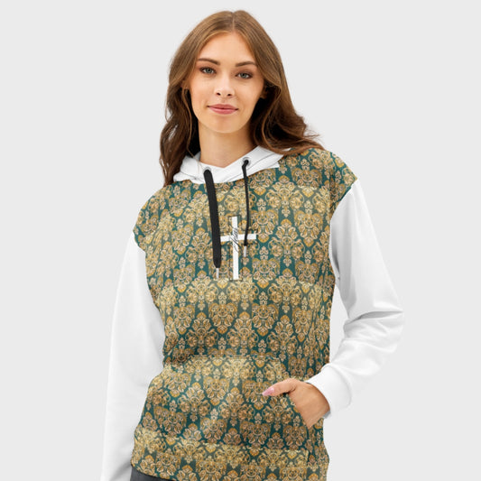 Portrait of woman wearing a hoodie with a ornamented pattern and a white cross at the center chest