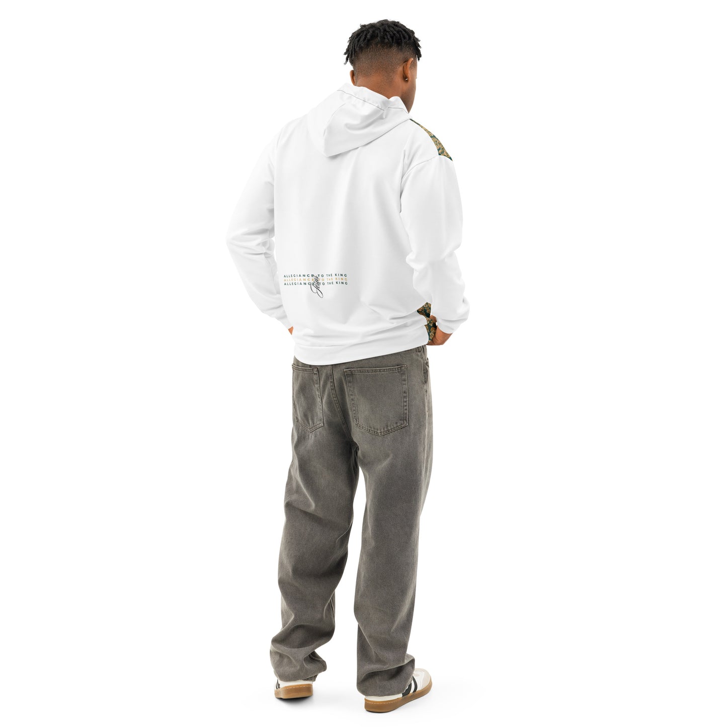 Man from behind wearing white hoodie with subtle text on plain background