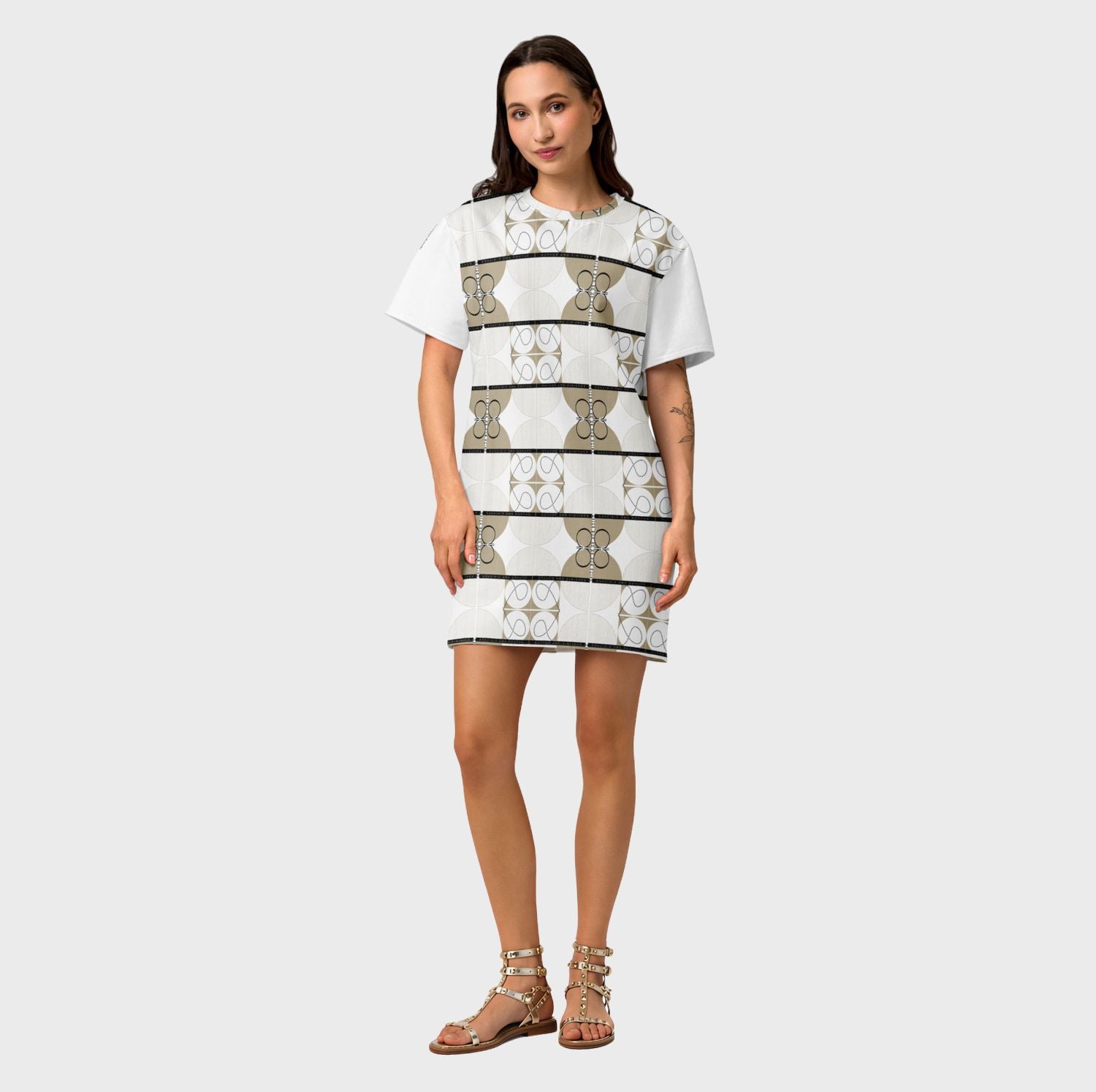 Woman wearing a patterned dress on a plain background
