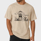 Beige t-shirt with 'El Camino' graphic design worn by a person on a light gray background