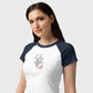 Woman wearing a white and navy baseball shirt with a graphic design on a plain background