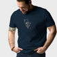 Man wearing a navy blue t-shirt with a graphic design on a plain background
