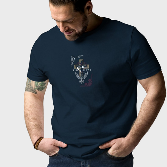Man wearing a navy blue t-shirt with a graphic design on a plain background