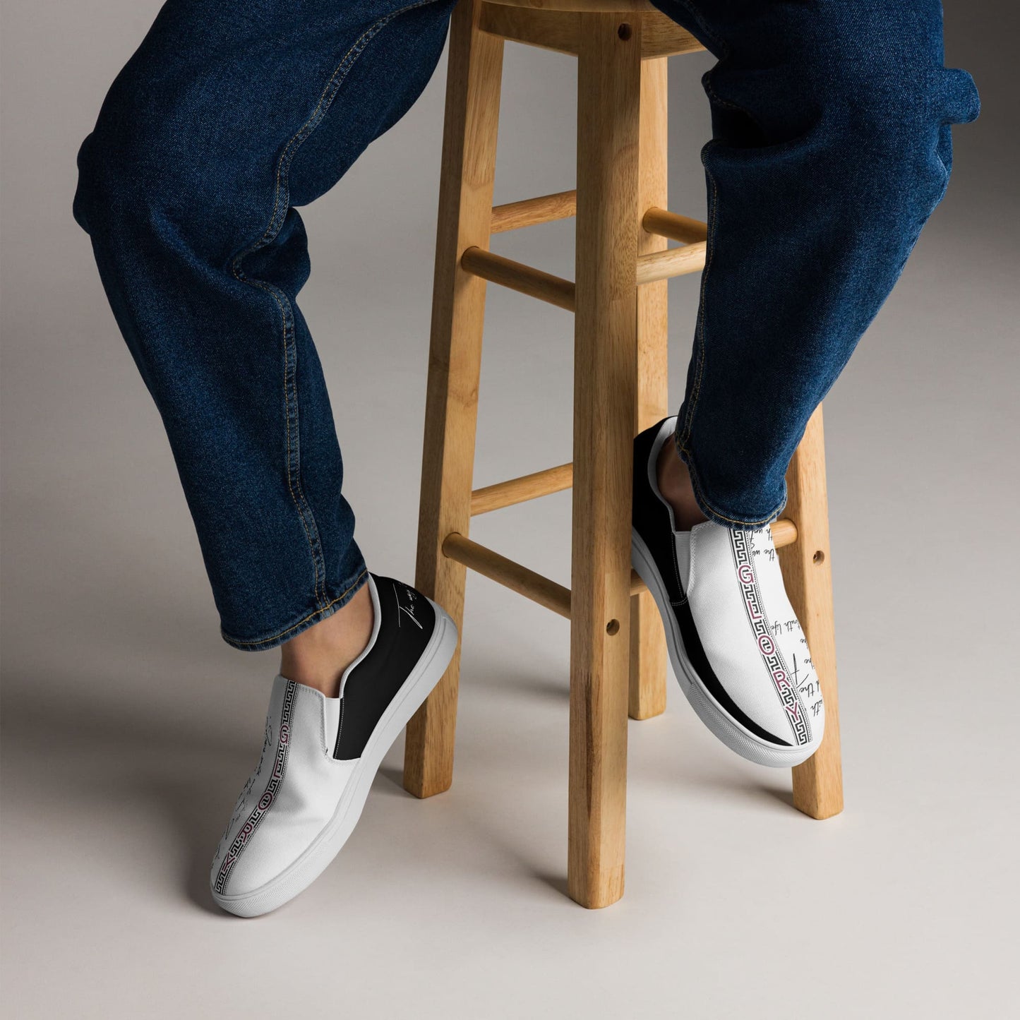 Legs of a person sitting on a chair wearing shoes with text GLORY