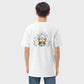 Man wearing white Christian tshirt with graphic design featuring angels and letters Glory to Jesus visible from behind