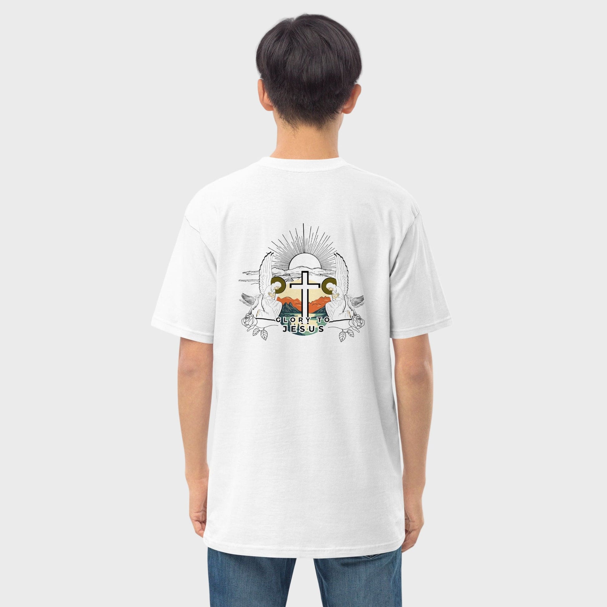 Man wearing white Christian tshirt with graphic design featuring angels and letters Glory to Jesus visible from behind