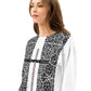 Woman wearing a black and white patterned top with text on a white background