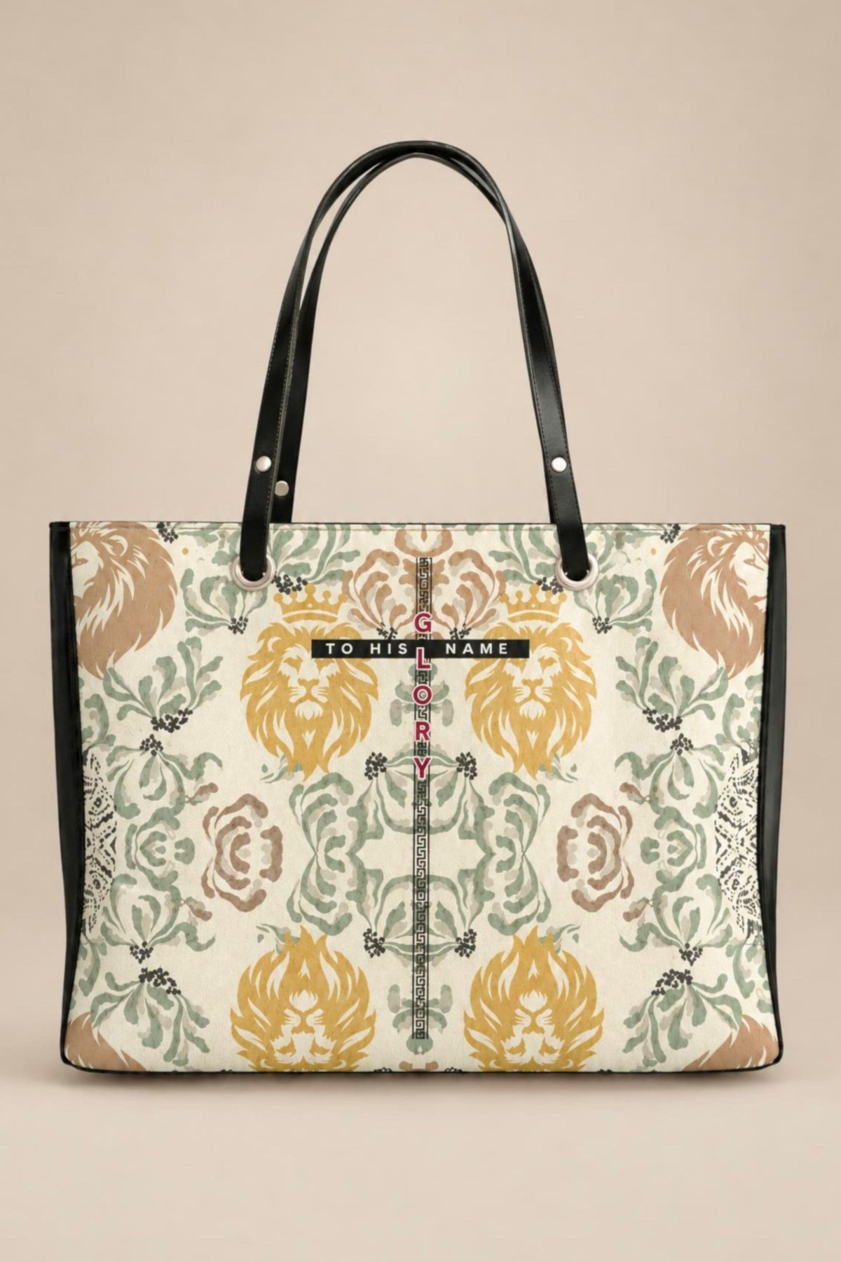 A  tote bag featuring a vintage-style lion and floral damask pattern in muted yellow, green, and brown on an off-white background, with black leather handles and trim.