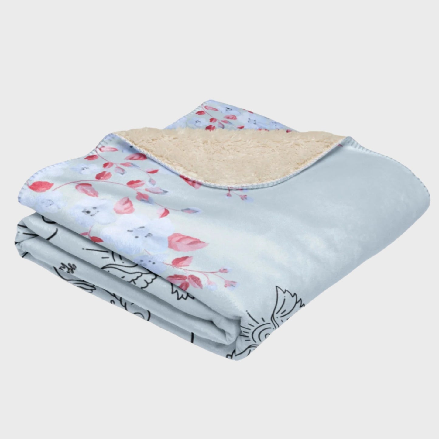 Folded light blue blanket with flower elements 