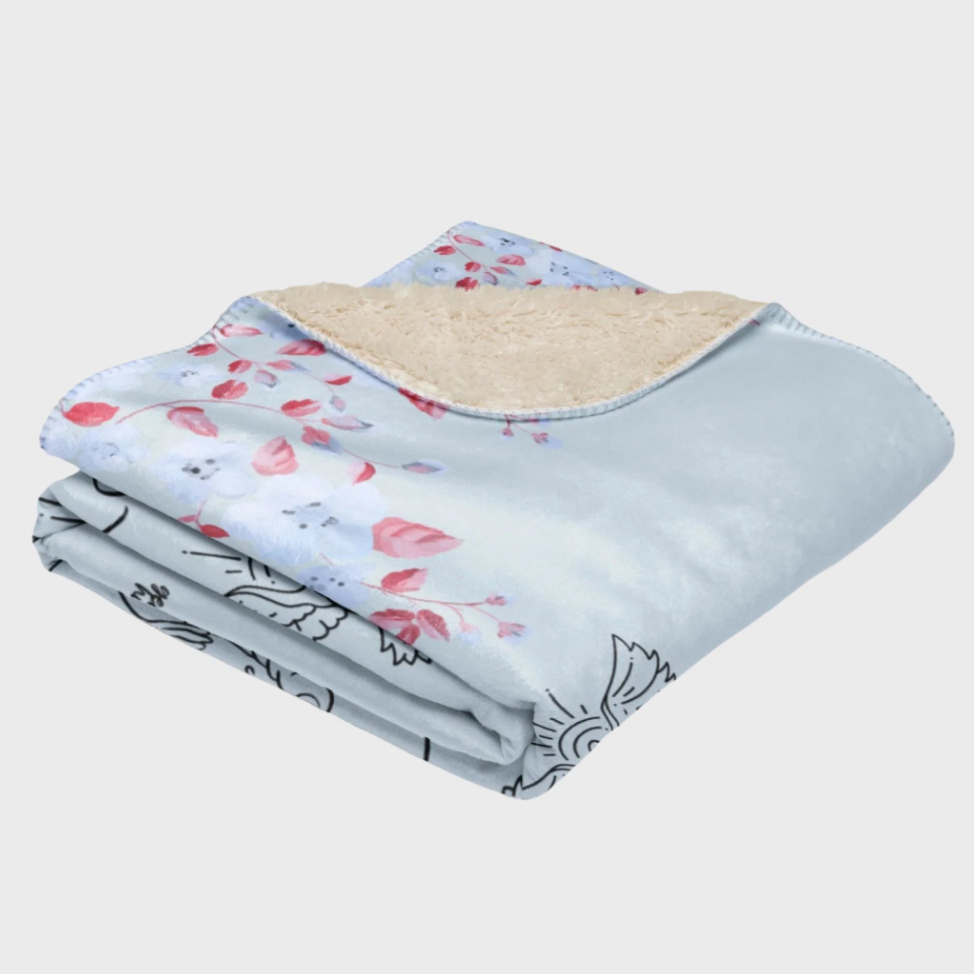 Folded light blue blanket with flower elements 