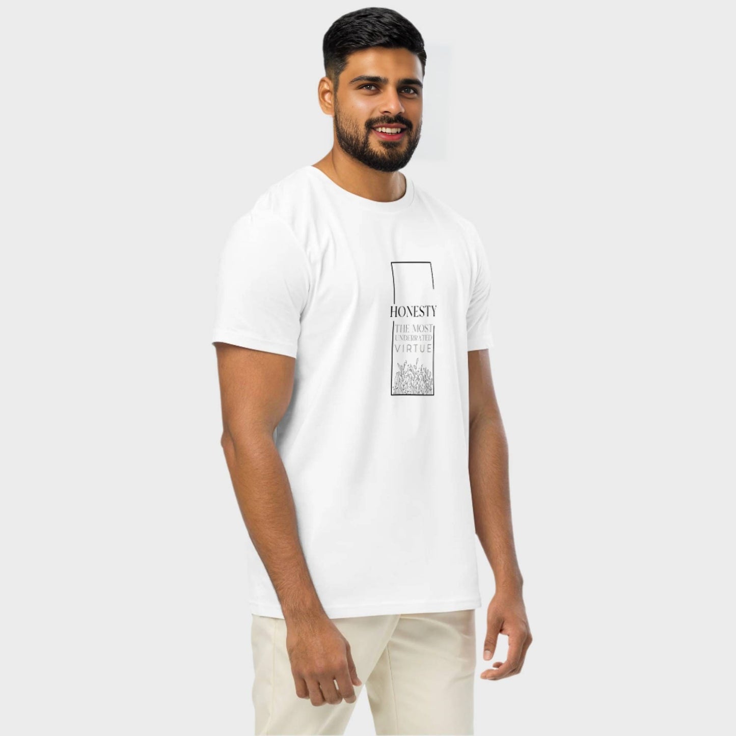 Man wearing white t shirt with text design HONESTY