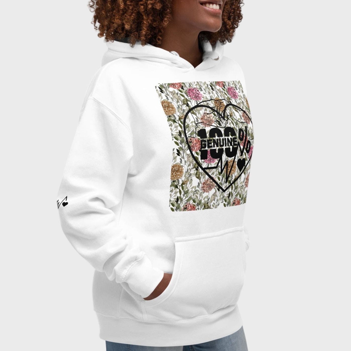 Woman wearing hoodie with floral heart design and text on a white background