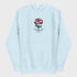 Light blue hoodie with a red rose graphic and text on a light gray background