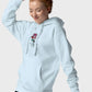Woman wearing light blue hoodie with rose graphic in the center