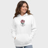 Woman wearing a white hoodie with a red rose design and Jesus text on a plain background