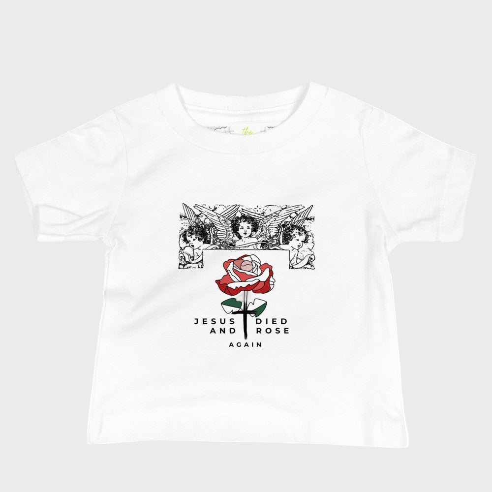 White baby t-shirt with a graphic design of a rose and text Jesus died and rose again product mockup