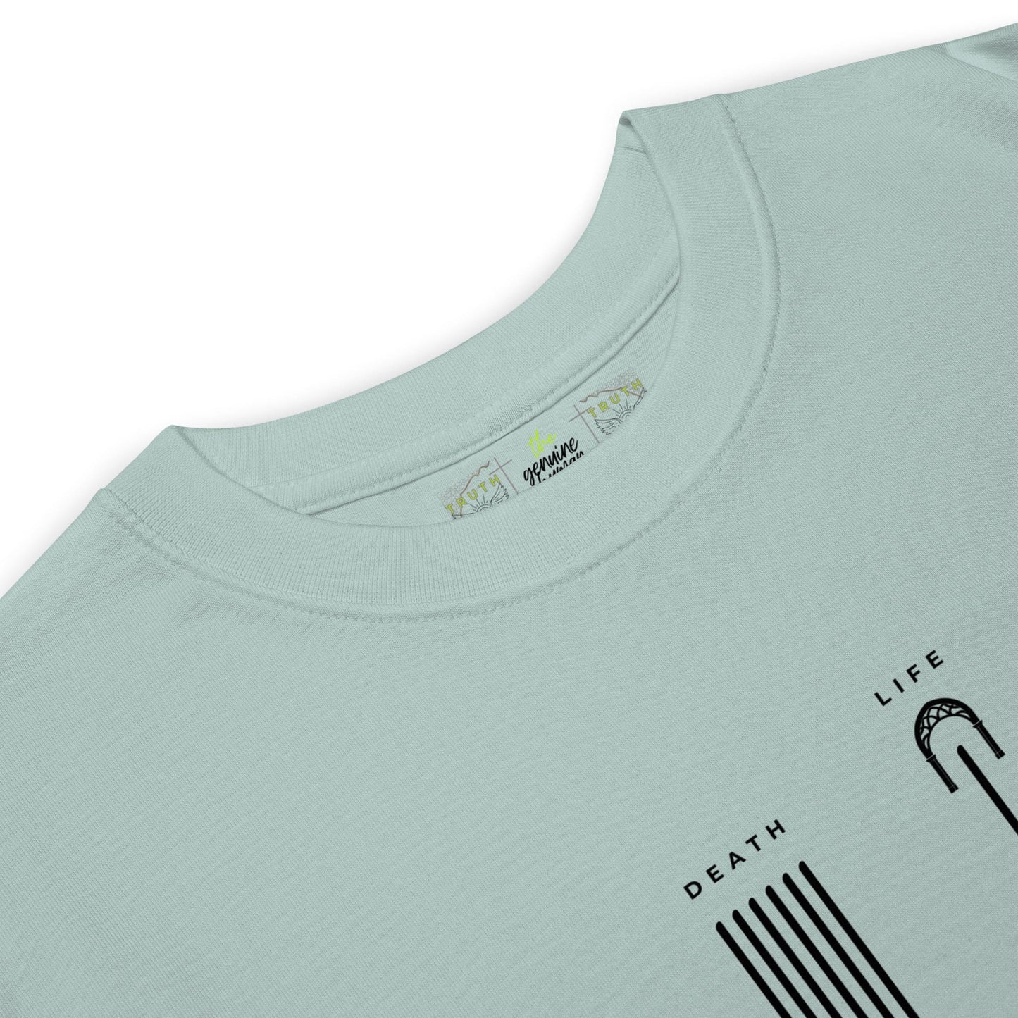 Close up of agave colored shirt with text LIFE and DEATH 