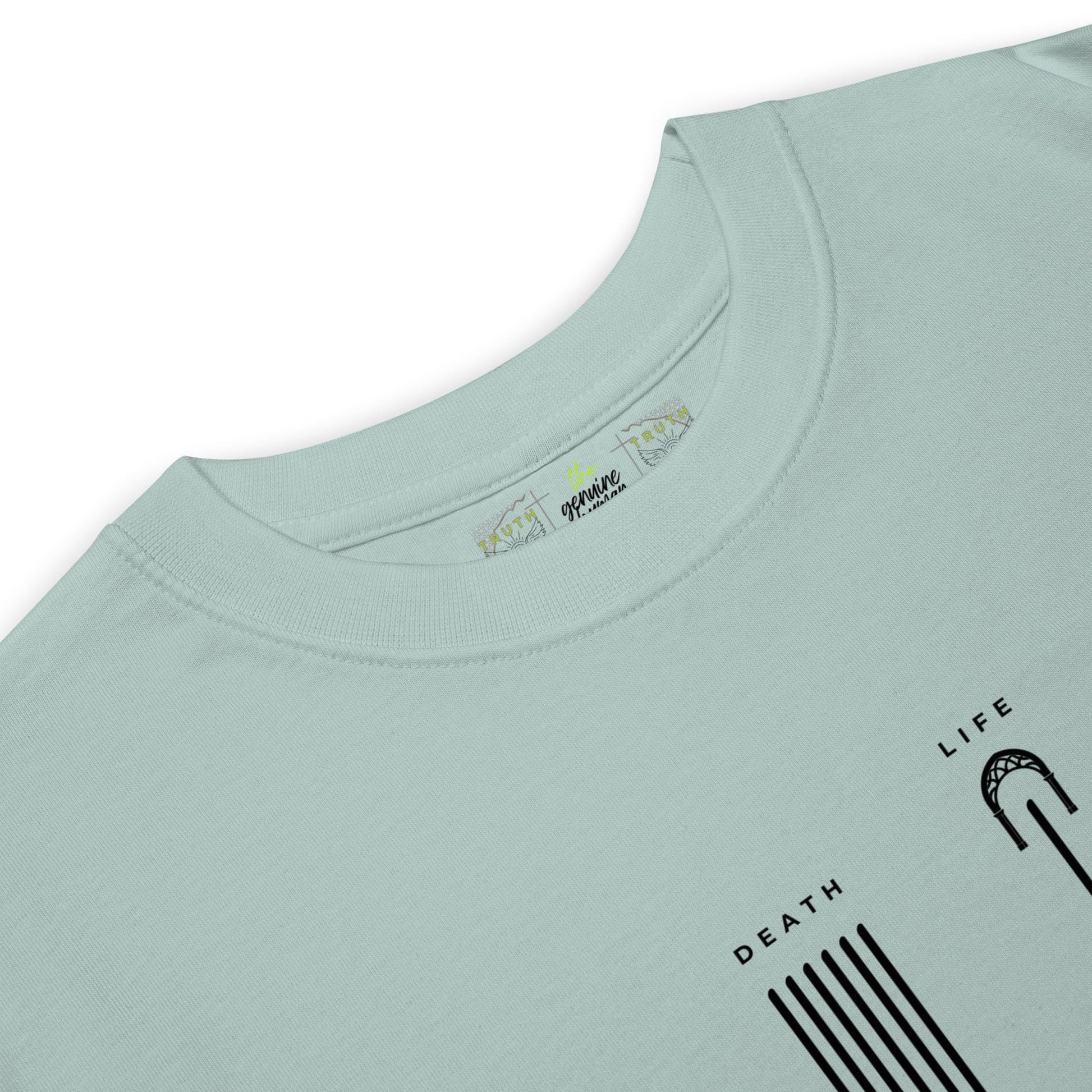 Close up of agave colored shirt with text LIFE and DEATH 