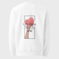 White crewneck sweatshirt with a front graphic print featuring a pink heart, a hand, and the text 'KINDNESS THE MOST UNDERRATED virtue'.