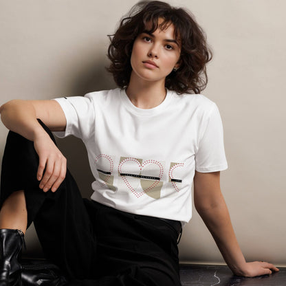 Woman-wearing-white-tshirt-with-text-Love_thy_neighbor-and dotted hearts-on-plain-background