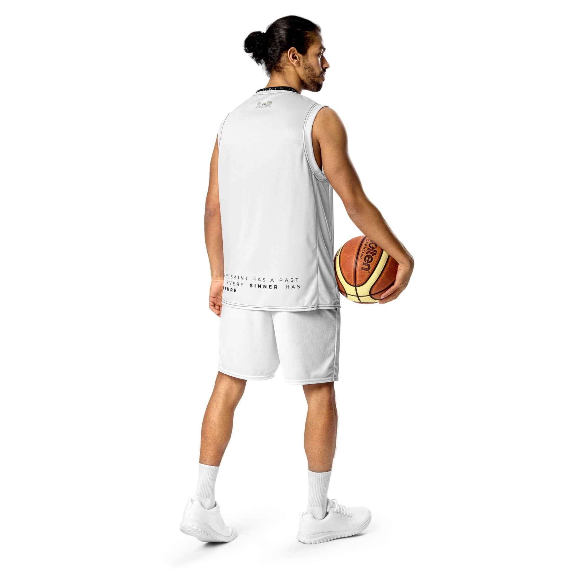 Man wearing Sports Tank with text at the bottom and holding a basketball visible from behind