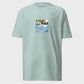 Light blue t-shirt with a graphic design and text on a light gray background
