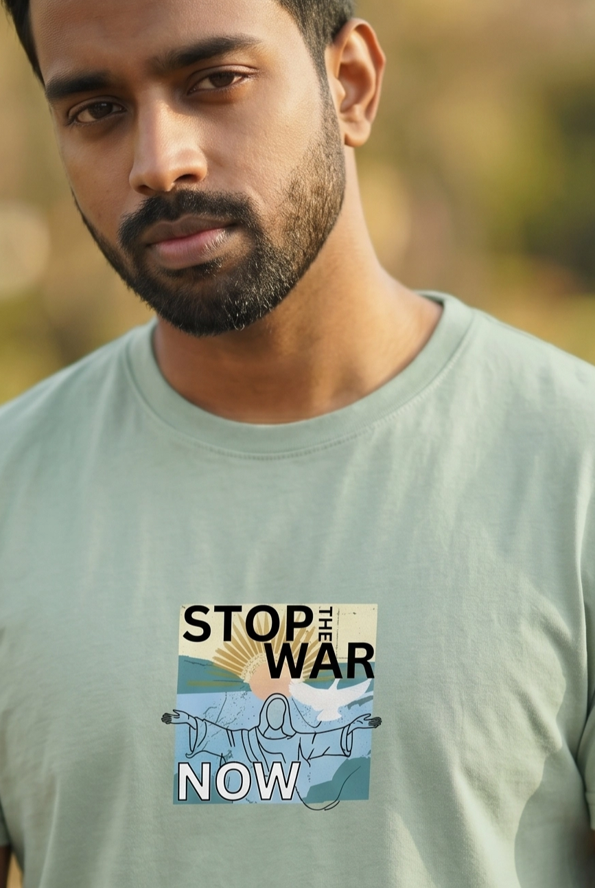 Man wearing a t-shirt with 'Stop the War Now' graphic design.