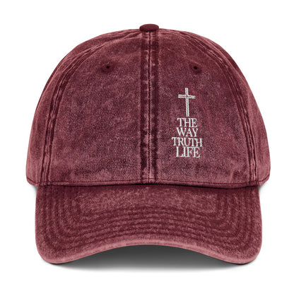 Maroon cap with cross and 'The Way Truth Life' text on a white background