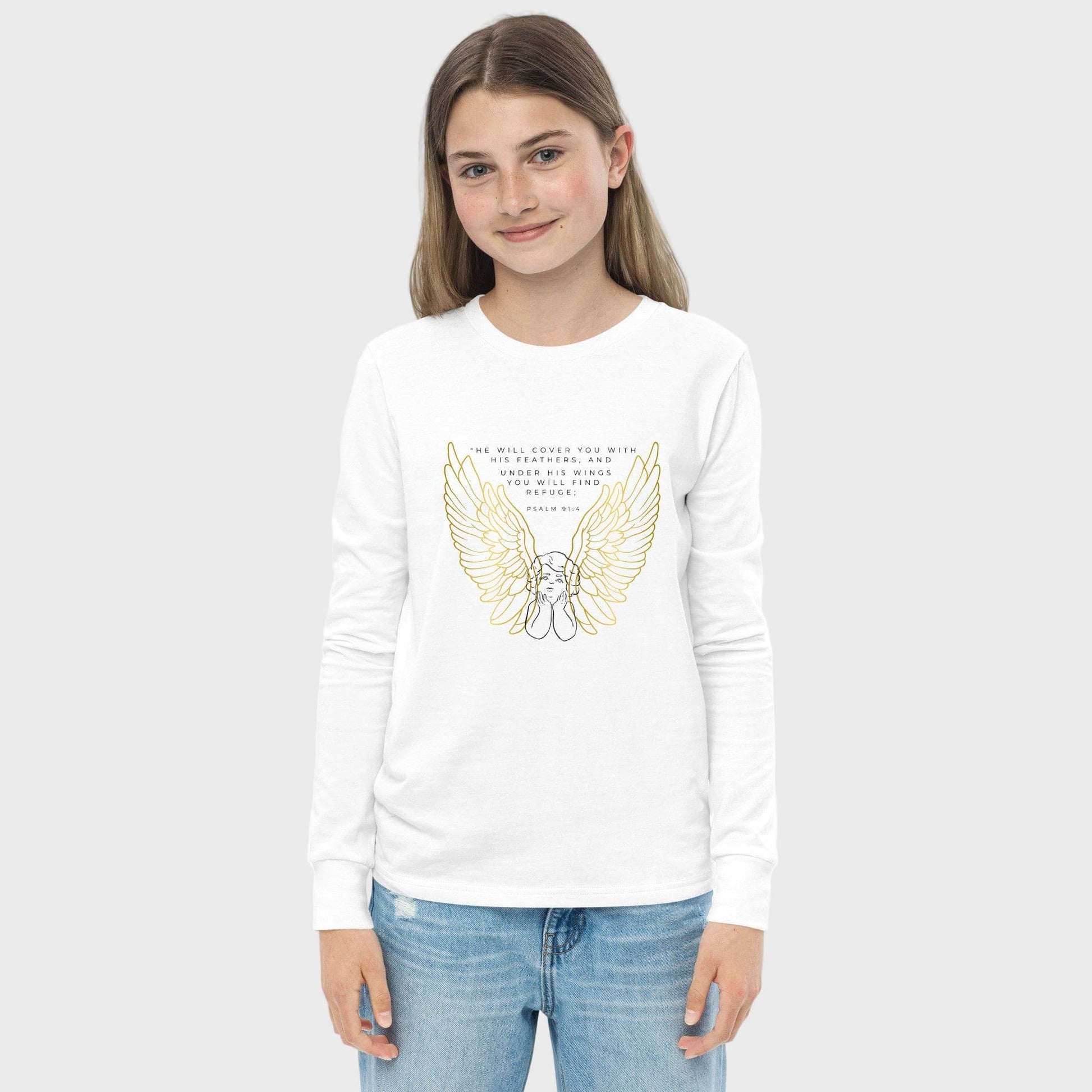Girl wearing a white long-sleeve shirt with gold wings and text on a plain background