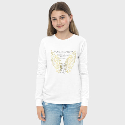 Girl wearing a white long-sleeve shirt with gold wings and text on a plain background