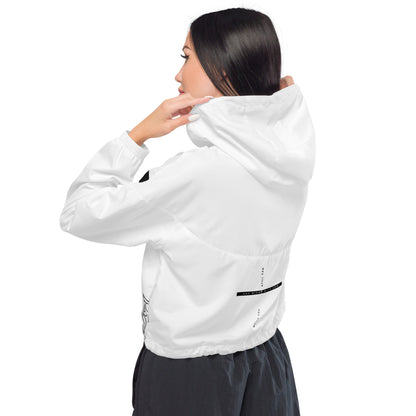 Woman wearing a white faith based windbreaker jacket visible from behind
