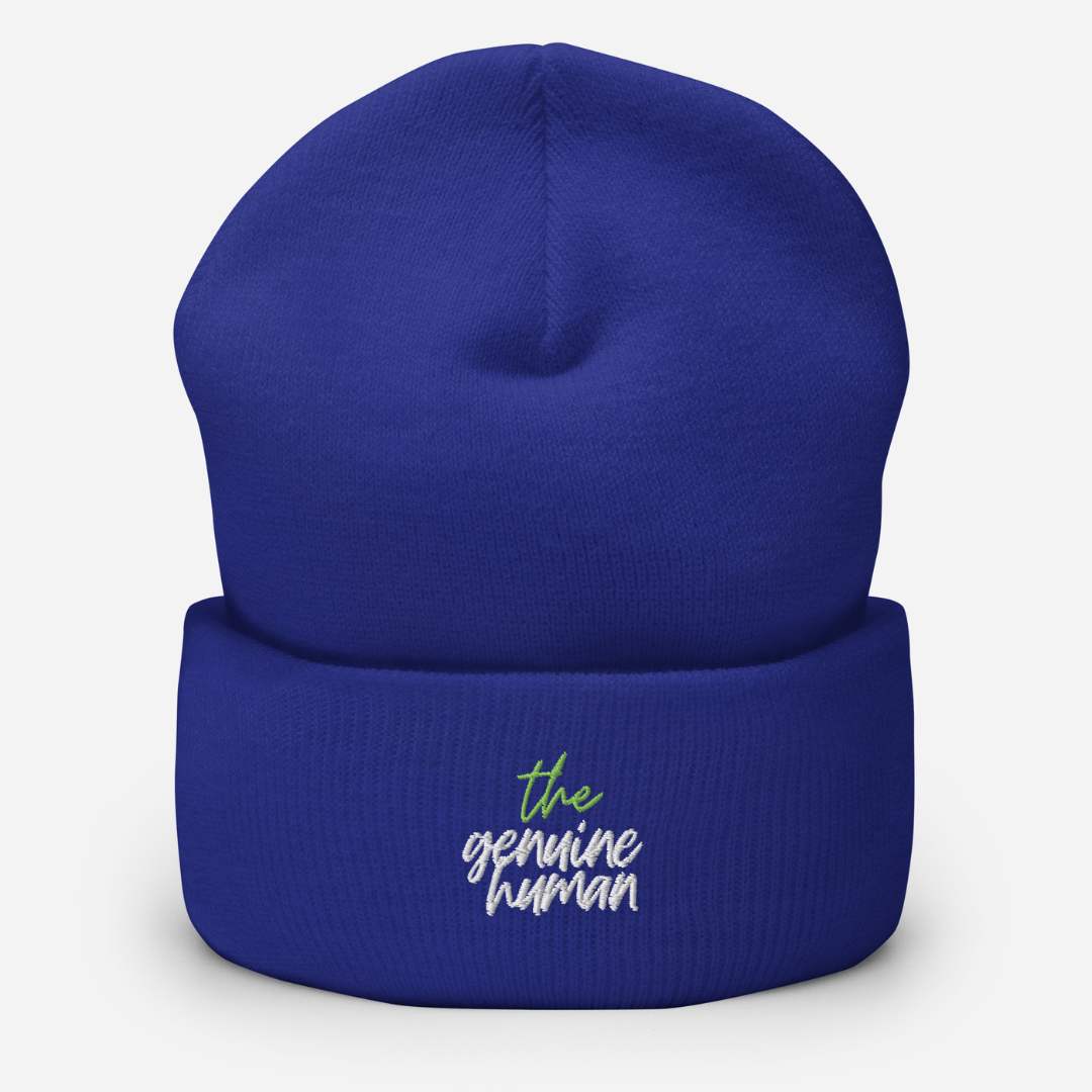 Vibrant blue beanie hat with text thegenuinehuman 