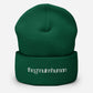 Green beanie with 'the genuine human' text on a white background