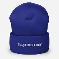 Blue beanie with white text on a white background