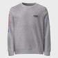 A gray sweatshirt with a text logo on the chest and a photographic letter print on the sleeve.